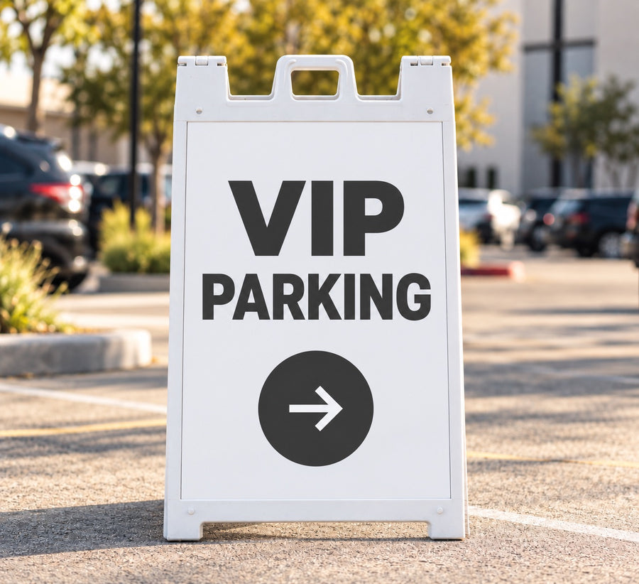 White sidewalk A-frame sign with a printed insert reading VIP Parking and an arrow